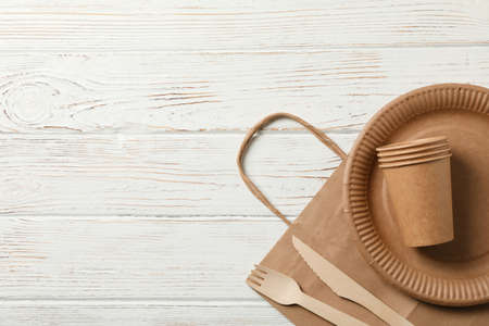 Concept with eco - friendly tableware on wooden background, copy spaceの写真素材
