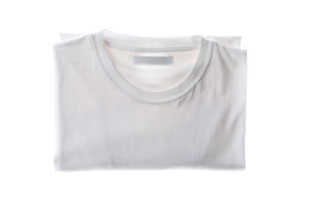 Folded white t-shirt isolated on white background, space for textの写真素材