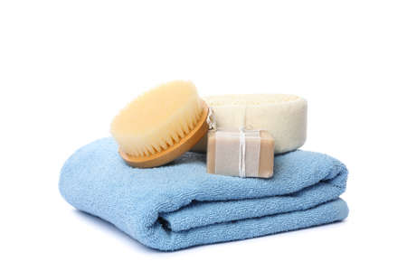 Towel, brush, soap and washcloth isolated on white background