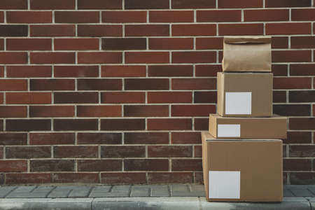 Blank boxes against brick wall background, space for textの写真素材