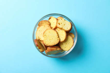 Crackers. Beer snacks on blue background, space for text. Top view