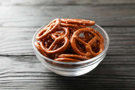 Beer snacks on wooden background, space for text. Closeup