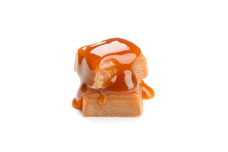 Caramel candies with sauce isolated on white backgroundの写真素材
