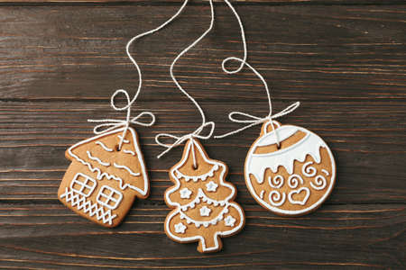 Tasty homemade Christmas cookies on wooden background, space for text. Top view