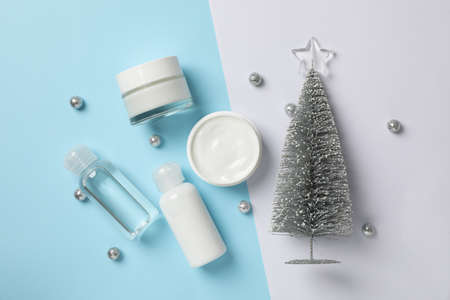 Set cosmetics, jar of winter cream for skin on two tone background, space for text. Top viewの写真素材
