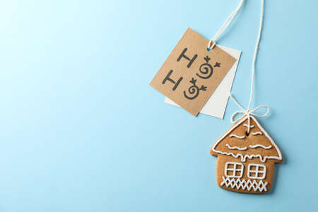 Homemade Christmas cookies, Ho-Ho on blue background, space for text. Top view