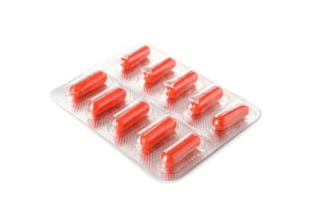 Capsules pill in blister pack isolated on white backgroundの写真素材