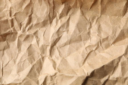 Crumpled craft paper texture background, close up