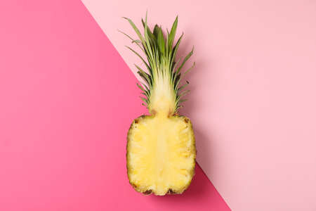 Half of pineapple on two tone background, space for textの写真素材