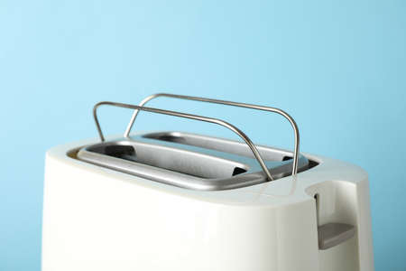 Toaster on blue background, close up and space for textの写真素材