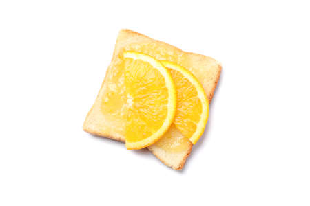 Toast with orange slices and jam isolated on white backgroundの写真素材