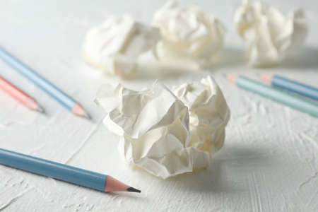 Paper balls and pencils on white table, close upの写真素材
