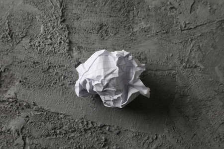 Paper ball on grey background, space for textの写真素材