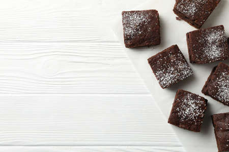 Chocolate cake slices on white wooden background, top viewの写真素材