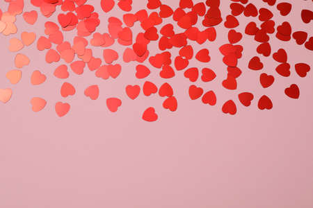 Decorative hearts on pink background, space for text