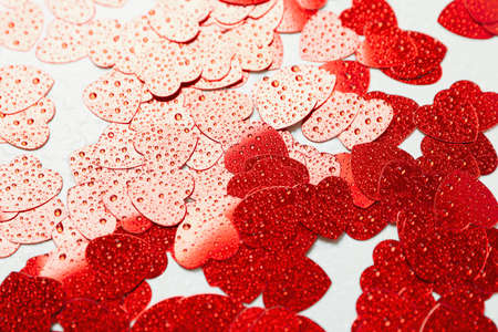 Glitter hearts with water drops on white background, close upの写真素材