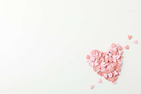 Heart made of decorative hearts on white background, space for text