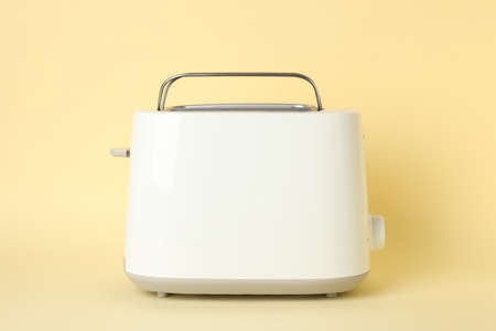 Toaster for bread on beige background, space for textの写真素材