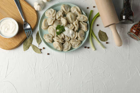 Composition with tasty dumplings on white background, space for textの写真素材