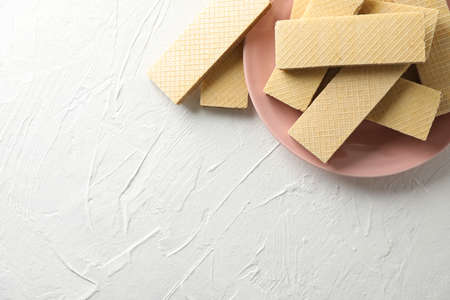 Plate with sweet wafers on white background, space for textの写真素材
