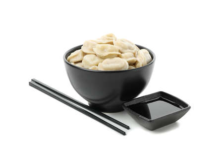 Bowl with dumplings, chopsticks and soy sauce isolated on white backgroundの写真素材