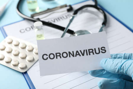 Composition of protective agents against Coronavirus on blue background, top view. Healthcare and medical conceptの写真素材