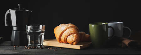 Composition with tasty croissant on wooden table, space for textの写真素材