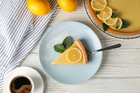 Composition with lemon tart on white wooden background. Sweet breakfastの写真素材