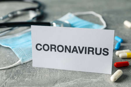 Composition of protective agents against Coronavirus on grey background, top view. Healthcare and...