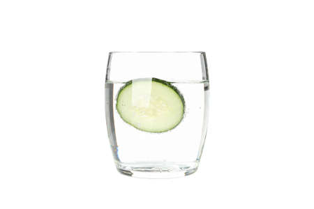 Glass with infused cucumber water isolated on white backgroundの写真素材
