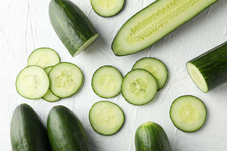 Fresh green cucumbers on white background, top viewの写真素材