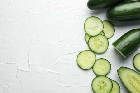 Fresh green cucumbers on white background, top viewの写真素材