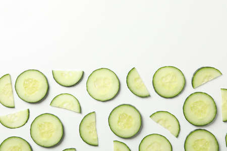 Flat lay with cucumber slices on white background, top viewの写真素材
