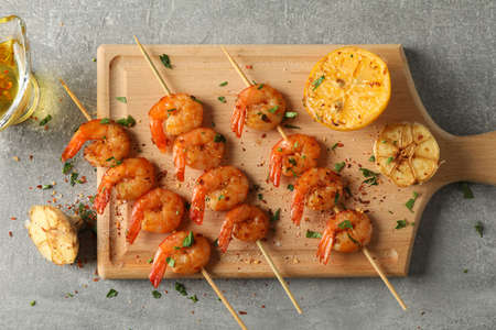 Composition with delicious shrimps on grey background, top viewの写真素材