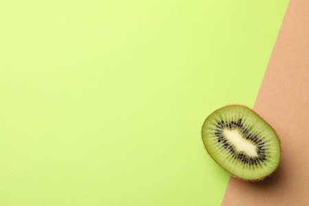 Ripe sweet kiwi on two tone background, top viewの写真素材