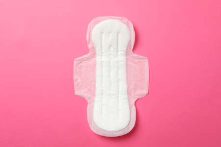 Sanitary pad on pink background, top viewの写真素材