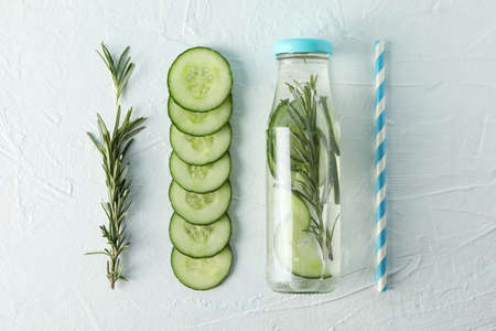 Composition with cucumber water and slices on white background, top viewの写真素材