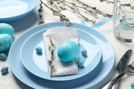 Easter table setting on white background, close upの写真素材
