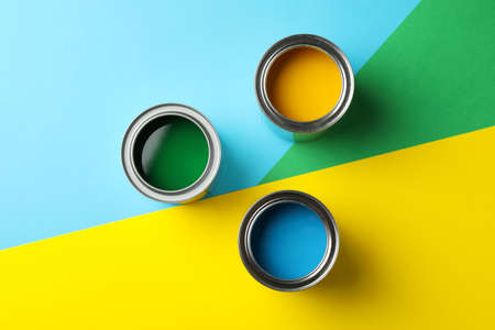 Different paints on multicolor background, top viewの写真素材