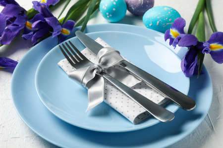 Easter table setting on white background, close up
