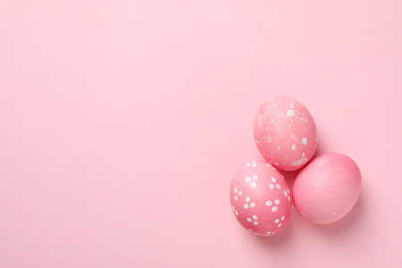 Easter eggs on pink background, space for textの写真素材
