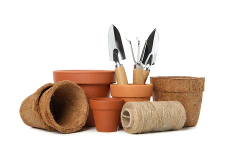 Flower pots and gardening tools isolated on white backgroundの写真素材