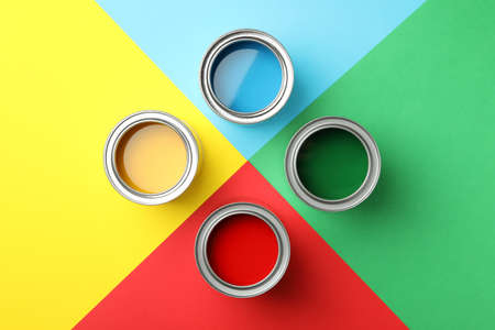 Different paints on multicolor background, top viewの写真素材