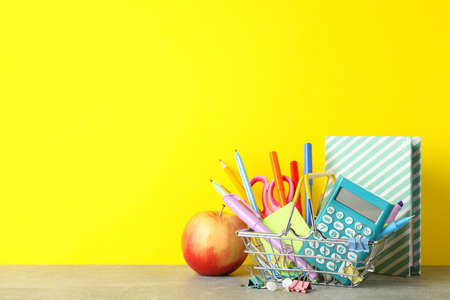 Apple and stationary on grey table. Study conceptの写真素材