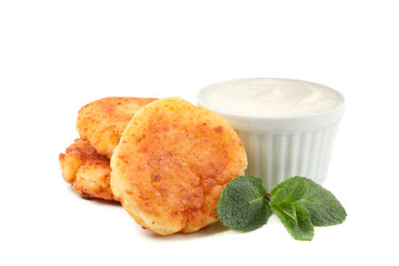 Cheese pancakes, sour cream and mint isolated on white background