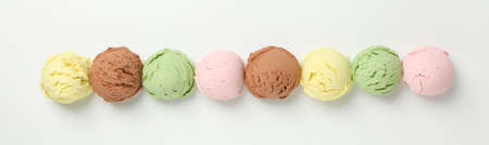 Ice cream balls on white background, top view. Horizontal photo