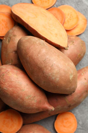 Sweet potato on grey background, top view. Vegetablesの写真素材