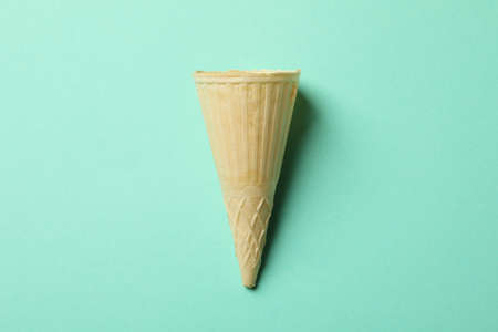 Waffle for ice cream on mint background, space for textの写真素材