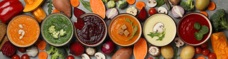 Vegetable soups and ingredients on grey background, top viewの写真素材