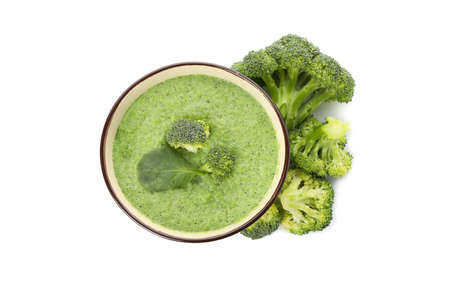 Bowl with broccoli soup isolated on white backgroundの写真素材